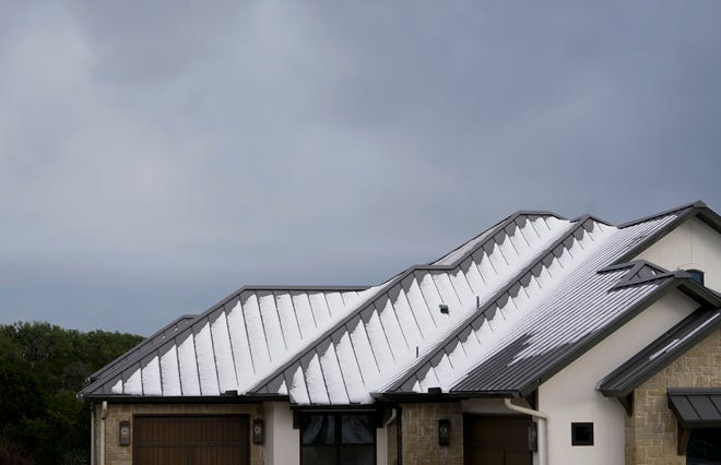 Hail is on the roof of a house in the Belvedere neighborhood on Hamilton Pool Road near Bee Cave Wednesday March 27, 2024.